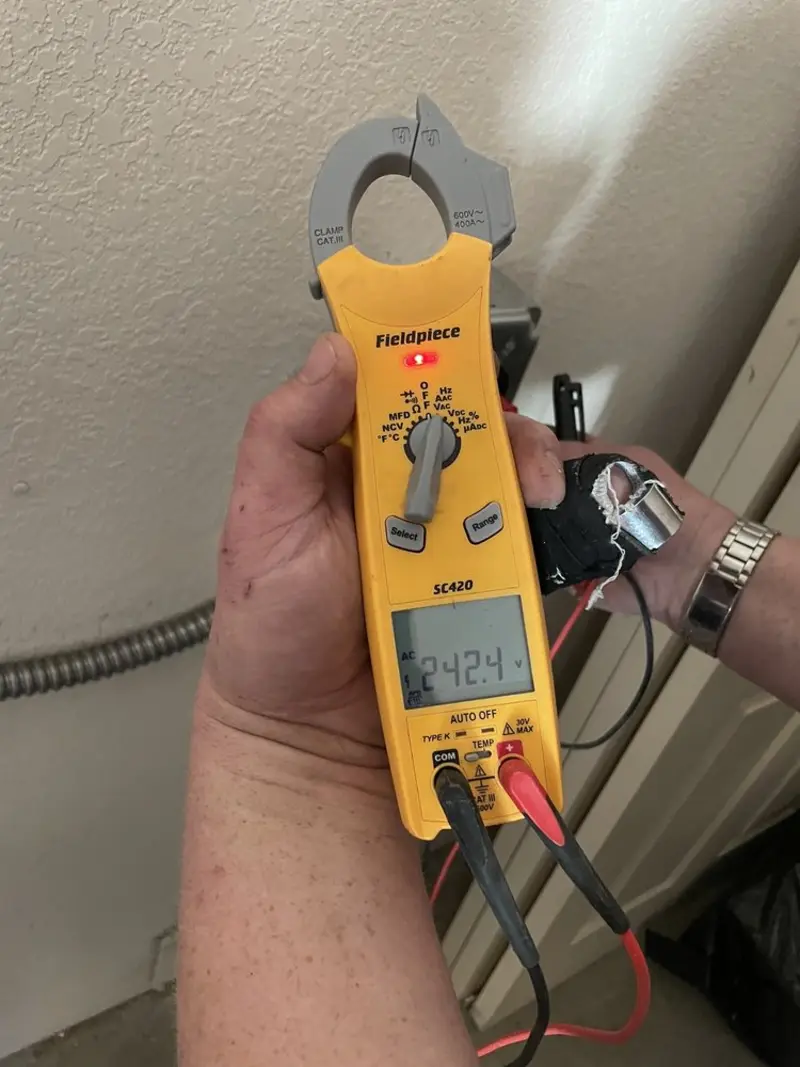 Voltage testing with clamp meter during Ceiling Fan Installation in Thief River Falls